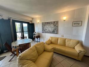 a living room with a couch and a table at Villa CHIA in Chia