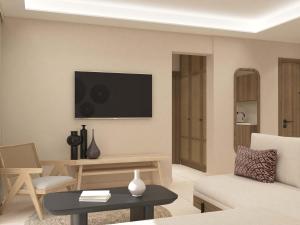 Telewizja i/lub zestaw kina domowego w obiekcie Τhe Noverian Antama Organic Beach Resort Chania