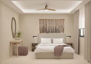 sypialnia z łóżkiem i wentylatorem sufitowym w obiekcie Τhe Noverian Antama Organic Beach Resort Chania w mieście Agia Marina Nea Kydonias
