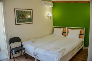 Postel nebo postele na pokoji v ubytování Communa Guesthouse