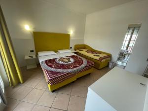 Postel nebo postele na pokoji v ubytování Villa Daniela