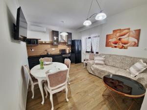 a living room with a couch and a table at Gariful in Drniš