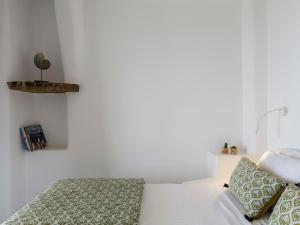 A bed or beds in a room at Tinostra Casa