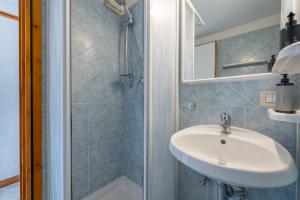 a bathroom with a sink and a shower at Panieri Apt - Homkeey Apartments in Rome