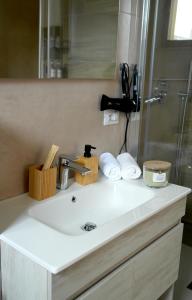 a bathroom counter with a sink and a shower at Monolocale Portofino in Turin +25 photos