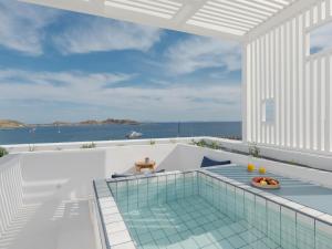 a swimming pool on the roof of a house at Aegean Colors Paros in Naousa