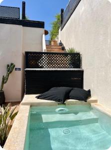 a swimming pool in the backyard of a house at Dar Belhaj in Marrakech
