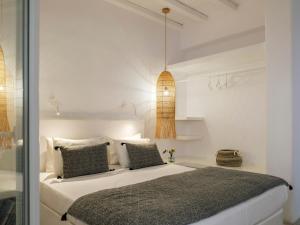 A bed or beds in a room at Tinostra Casa