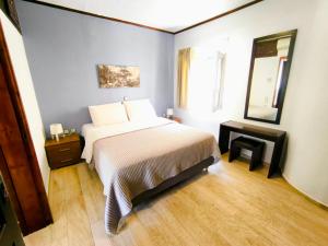 Кровать или кровати в номере Amimaya Apartments