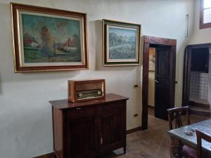 a living room with a painting on the wall at Ninfea Residenza Storica in Spoleto