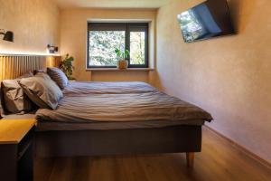 Postel nebo postele na pokoji v ubytování Tamme 10 Apartments