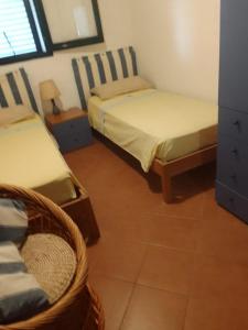Ένα ή περισσότερα κρεβάτια σε δωμάτιο στο Casa Frontemare fronte spiaggia