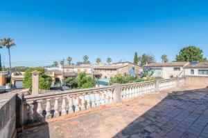 a stone railing on a bridge with houses in the background at Los Abilios in Palma de Mallorca