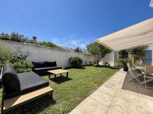Ogród w obiekcie Maison neuve 8 pers. avec terrasse, 600m de la plage, La Cotinière, Saint-Pierre-d'Oléron - FR-1-246A-185