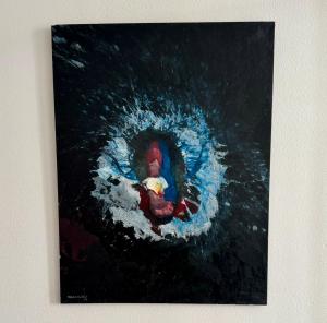 a painting of a man swimming in the water at L appartement du centre in Montauban +3 photos