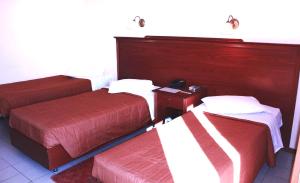 Postel nebo postele na pokoji v ubytování Apollo Hotel