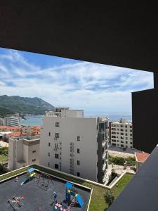a view from the top of a building with a playground at Vuelo Sobre Bečići in Bečići