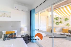 Ένα ή περισσότερα κρεβάτια σε δωμάτιο στο #283 Palmeira Gale by Home Holidays +40 φωτογραφίες