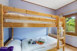 a bunk bed in a room with two bunk beds at Casa Clelia - Happy Rentals in Camedo