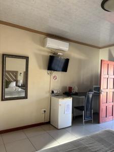 Η κουζίνα ή μικρή κουζίνα στο Kuruman Paradise Lodge