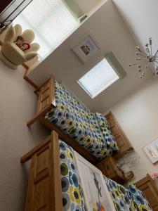 a room with two bunk beds and a window at Pennisula Apartment in Portrush