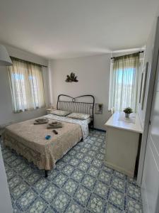 Postel nebo postele na pokoji v ubytování B&B La Marinella