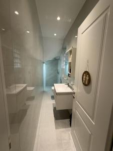 Koupelna v ubytování PAVÉ Apartment + 13 fotografií