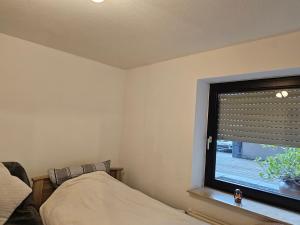 Postel nebo postele na pokoji v ubytování Ferienwohnung Löhr Essen Kettwig