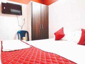 Postel nebo postele na pokoji v ubytování Hotel Jyothi Kumar Royal