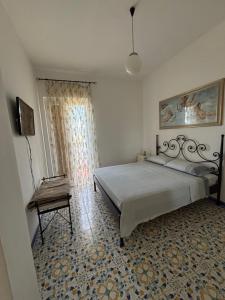 Postel nebo postele na pokoji v ubytování B&B La Marinella