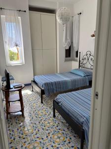 Postel nebo postele na pokoji v ubytování B&B La Marinella
