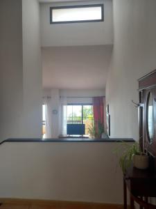 a living room with a skylight and a window at Townhouse Altea Hills in Altea