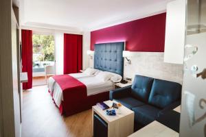 A bed or beds in a room at Europe Playa Marina - Adults Only
