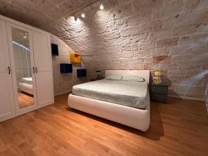 Ένα ή περισσότερα κρεβάτια σε δωμάτιο στο Green Retreat - Loft sul Mare - Casa Vacanze