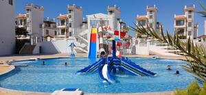 a water slide in the middle of a swimming pool at Sharm hills sea view in Sharm El Sheikh