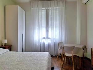 Postel nebo postele na pokoji v ubytování Nessun dorma b&b Pesaro