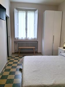Postel nebo postele na pokoji v ubytování Nessun dorma b&b Pesaro