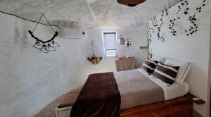 Postel nebo postele na pokoji v ubytování Bagos do Vilar