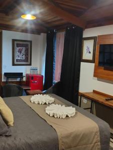 Postel nebo postele na pokoji v ubytování Casarão da Ducha hotel concept + 37 fotografií