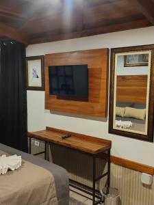 TV a/nebo společenská místnost v ubytování Casarão da Ducha hotel concept
