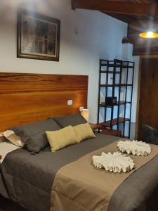 Postel nebo postele na pokoji v ubytování Casarão da Ducha hotel concept