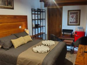 Postel nebo postele na pokoji v ubytování Casarão da Ducha hotel concept