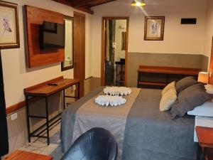 Postel nebo postele na pokoji v ubytování Casarão da Ducha hotel concept