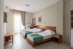 Postel nebo postele na pokoji v ubytování Hotel Akropol
