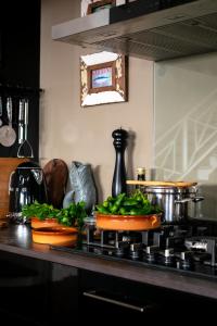 a kitchen counter with some vegetables on a stove at Villa by the Sea in Mala