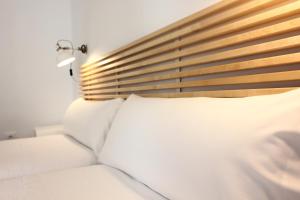 Posteľ alebo postele v izbe v ubytovaní Las Atarazanas - Design Hostal