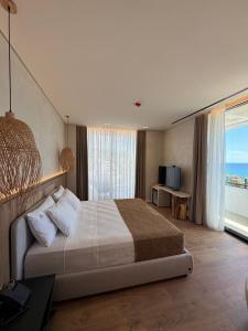 Katil atau katil-katil dalam bilik di Amarea Boutique Hotel