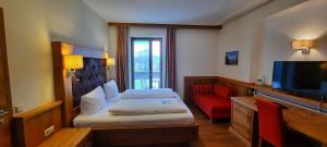 Postel nebo postele na pokoji v ubytování Hotel Gasthof Jägerhaus