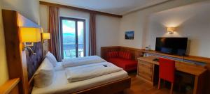 TV a/nebo společenská místnost v ubytování Hotel Gasthof Jägerhaus