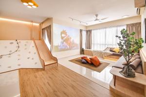 a large living room with a slide in it at PROMO WKEND Spacious Kid-Friendly KidsVille, MystTunnel 5Mins Legoland, JB Johor Malaysia in Nusajaya